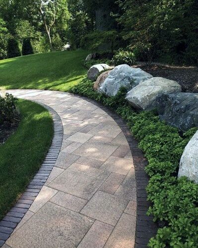 backyard-stamped-curved-concrete-walkway-home-designs